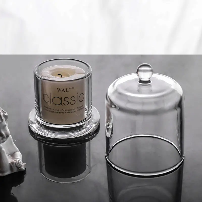 Small clear glass cloche candle holder shown open and covered