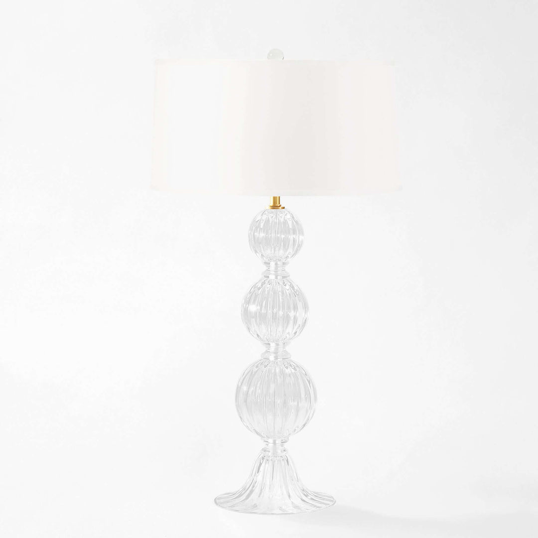 Decorative Murano glass table lamp with a white shade on a white background