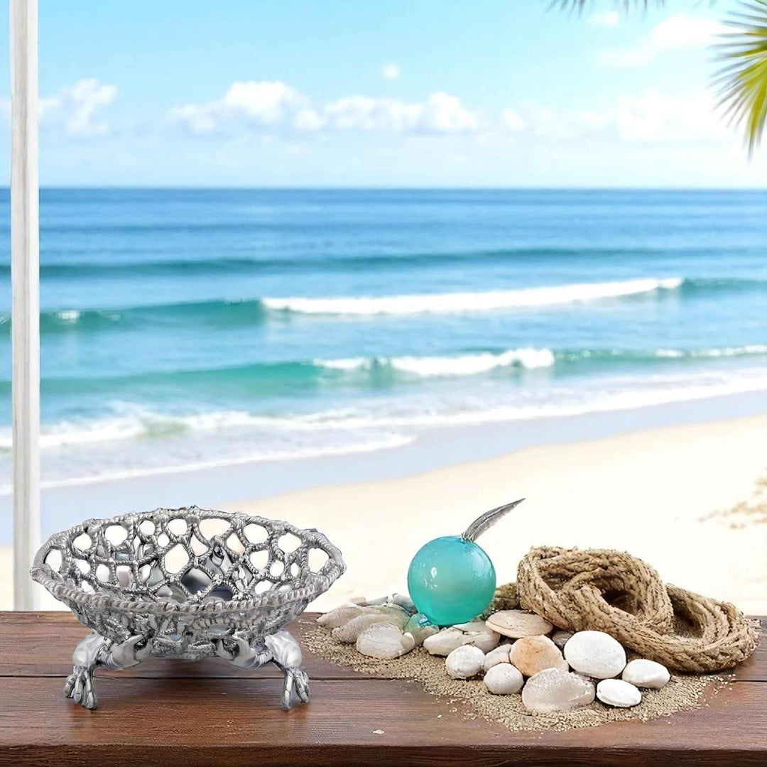 Coastal Crab and Net Fruit Basket displayed on a beach with ocean waves, showcasing seaside elegance and traditional maritime craftsmanship.