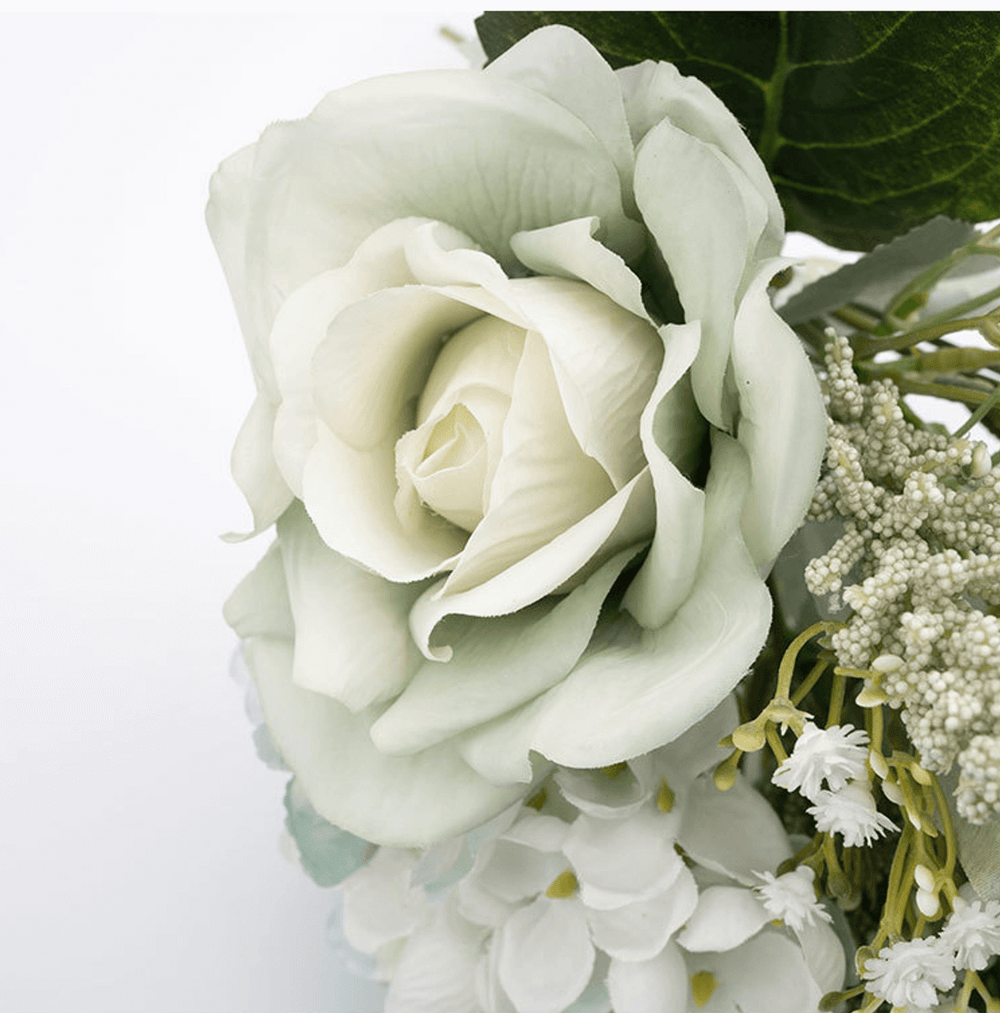 Cottagecore artificial floral arrangement with soft green rose and wildflowers, perfect for vintage decor.