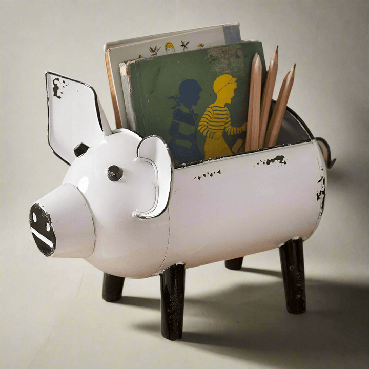 Rustic pig-shaped storage organizer holding books and pencils, featuring a distressed white finish and whimsical design.