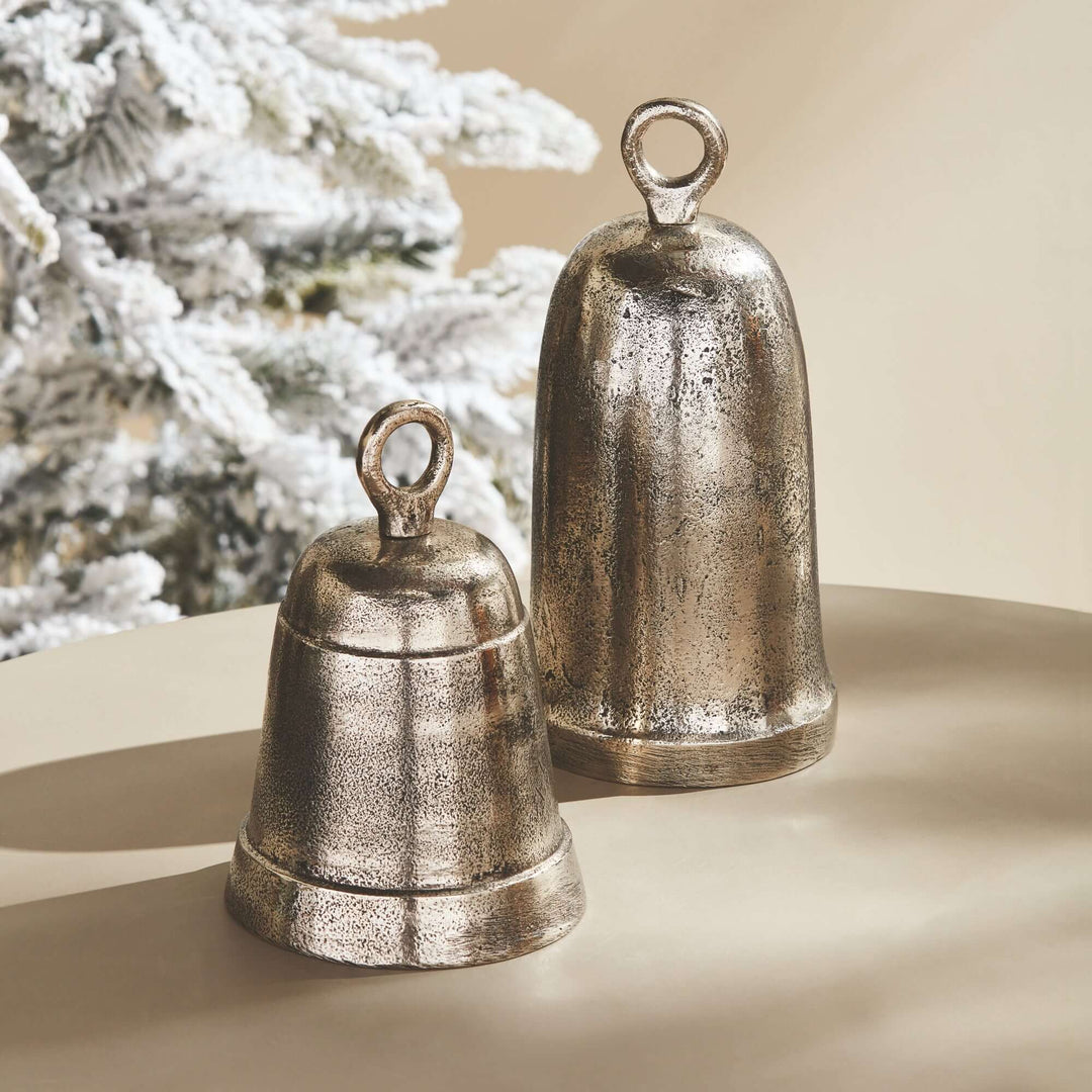 Set of 2 decorative functional bells with antique silver finish, elegantly displayed in a vintage home setting.