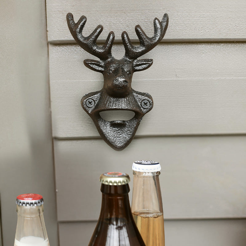 Deer Head Cast Iron Wall Bottle Opener mounted above glass bottles