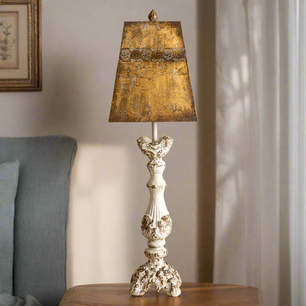 Distressed antique French country lamp with ornate wooden base and rustic metal shade, perfect for rustic decor.