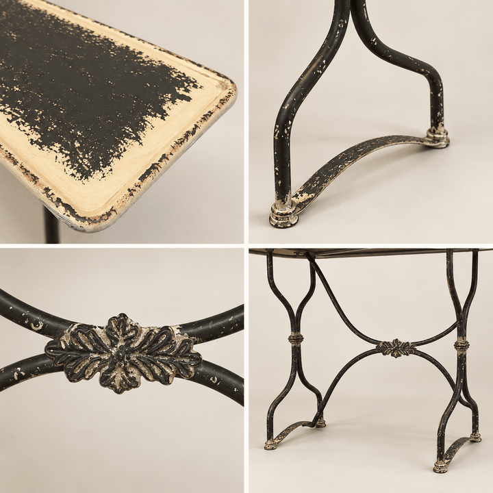 Close details of the Distressed Black and Cream Metal Console Table finish and ironwork