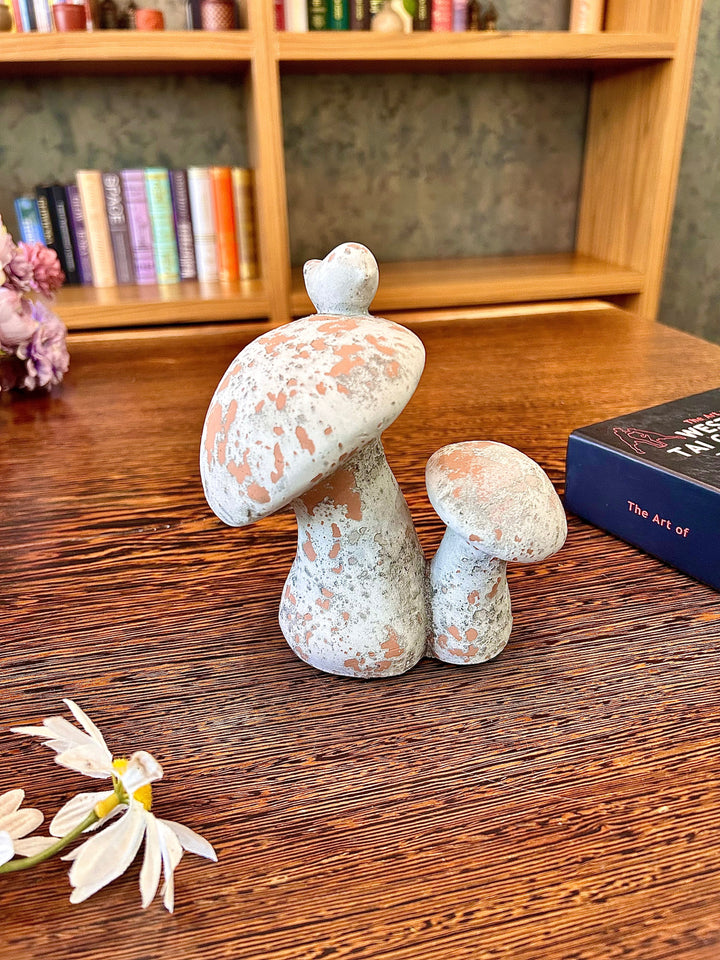 Distressed Cement Mushroom Sculpture with Perched Bird on a bookshelf display