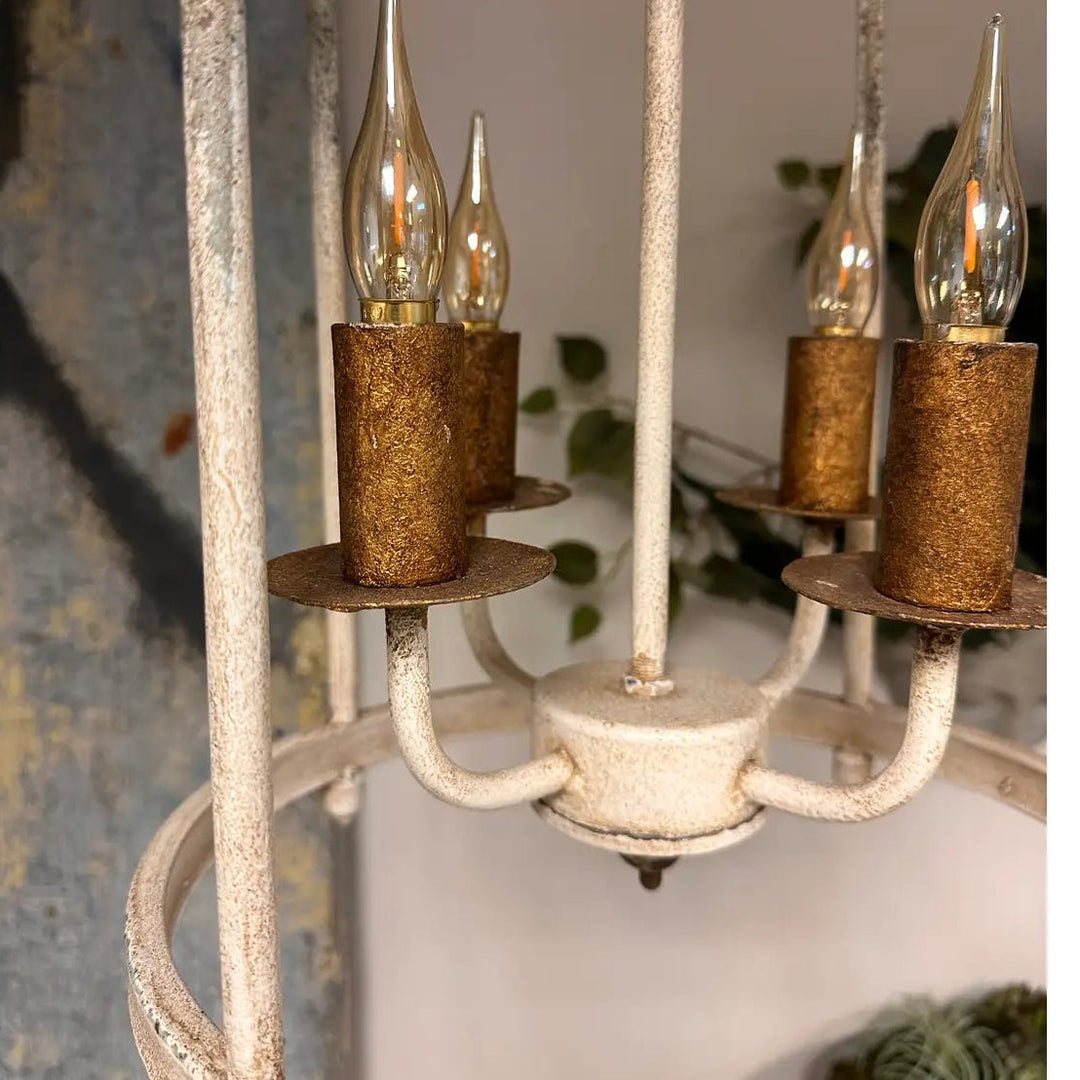 Close view of the four gold-toned candle sleeves