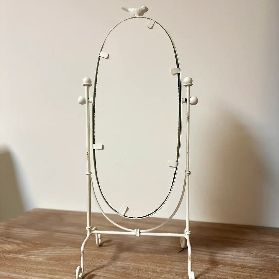 Back view of the adjustable oval swing mirror and iron stand