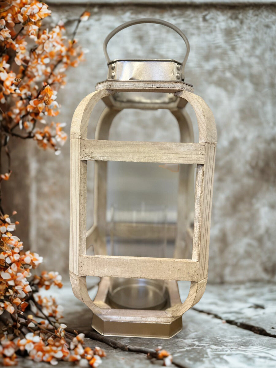 Tall distressed white wood lantern with clear glass candle chamber and metal handle