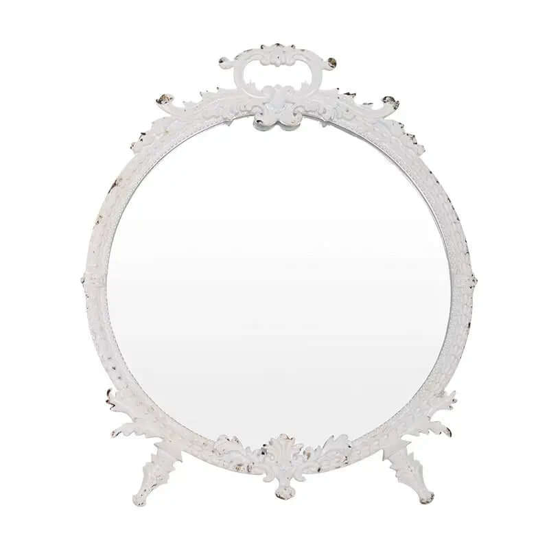 Distressed white vintage makeup mirror with ornate pewter frame, featuring intricate detailing and an aged finish.