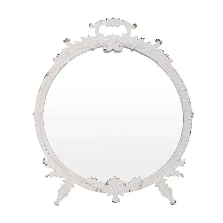 Distressed white vintage makeup mirror with ornate pewter frame, featuring intricate detailing and an aged finish.