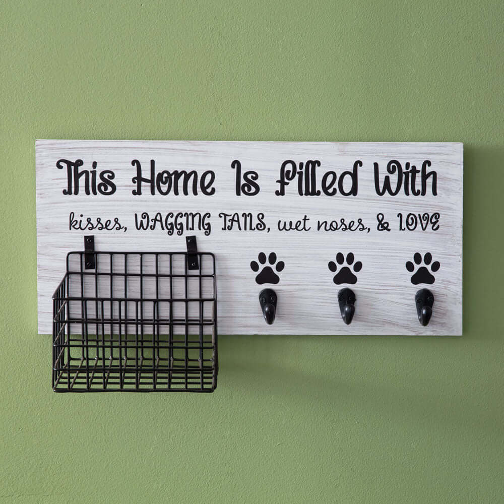 Dog Leash Organizer with Hooks and Basket featuring a sign with the words 'This Home is Filled with Kisses, Wagging Tails, and Love'.