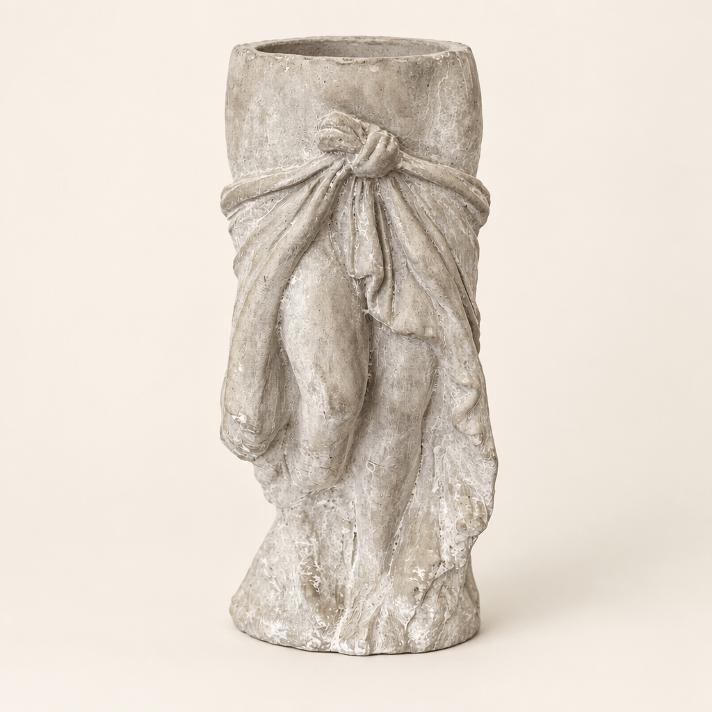 Draped skirt cement planter with sculpted waist tie on an ivory studio background