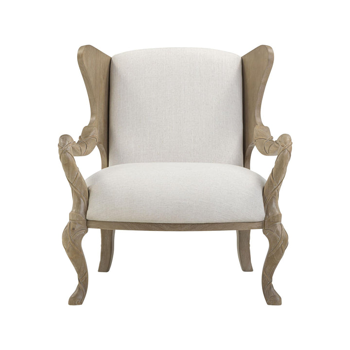 Front view of the driftwood armchair showing its winged back and ribbon-like arms.