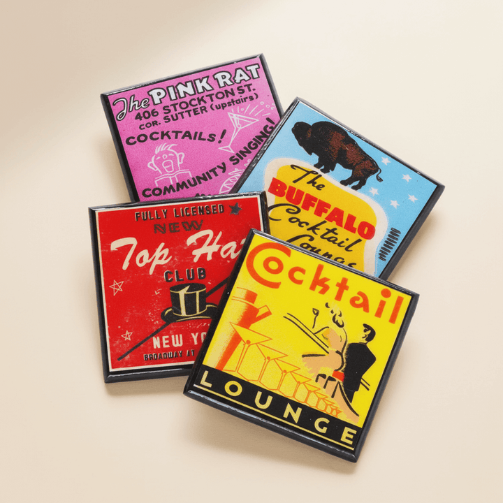 Four colorful vintage-style cocktail lounge coasters on a beige background