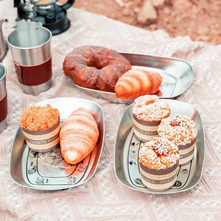 Engraved Country Scene Serving Trays presenting small decorated cakes
