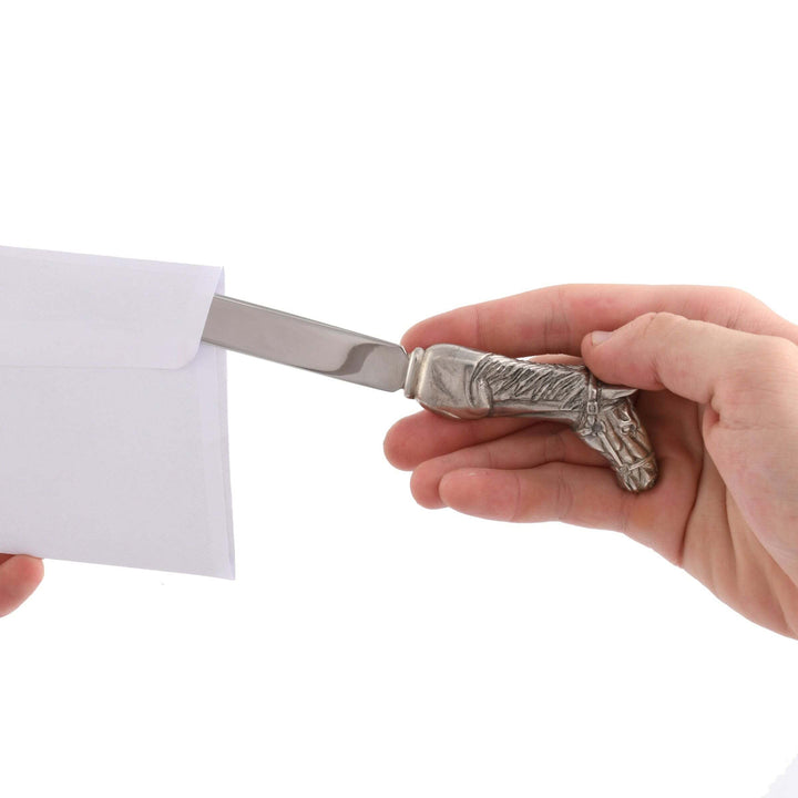 Using Equestrian Horse Head Letter Opener on white envelope, crafted in pewter and stainless steel, blending tradition with elegance.