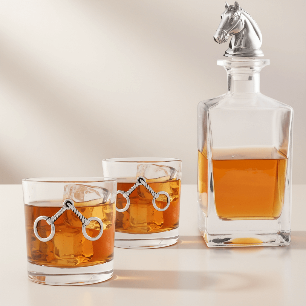 Equestrian Horse Head Whiskey Decanter Set on display with glasses filled with whiskey on a light surface.