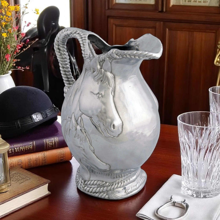 Equestrian Horse and Rope Pitcher with sculpted mare and foal, surrounded by books and glassware, showcasing Western style elegance.