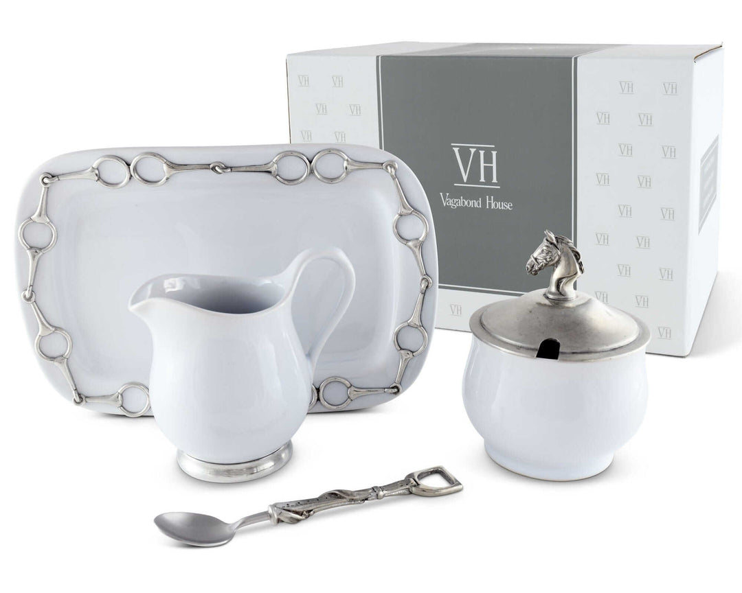 Equestrian Sugar and Creamer Set with Pewter Horse Head Details on display with plate and spoon