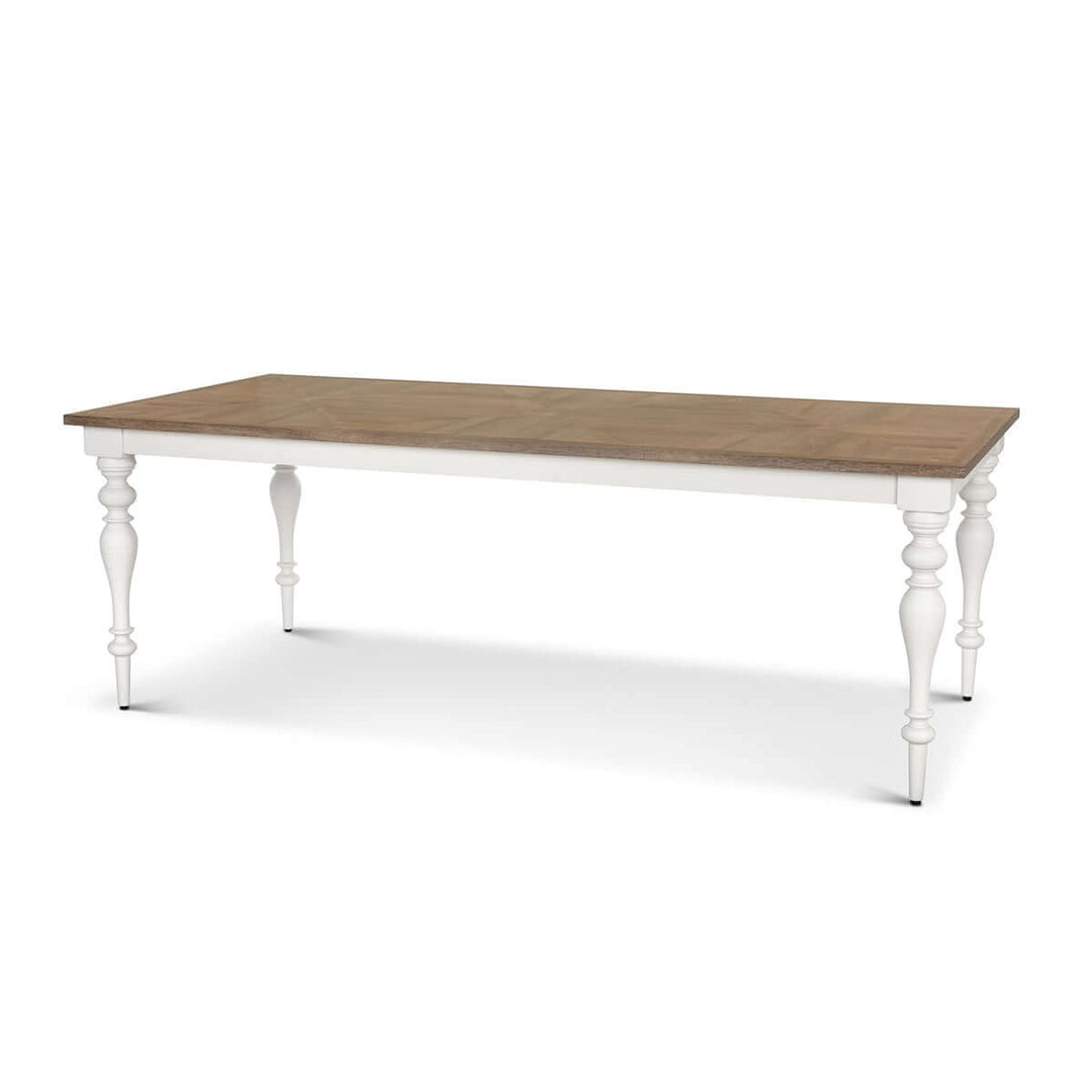 Farmhouse dining table with vintage white turned legs and rich wood top, ideal for country-style interiors and cozy gatherings.