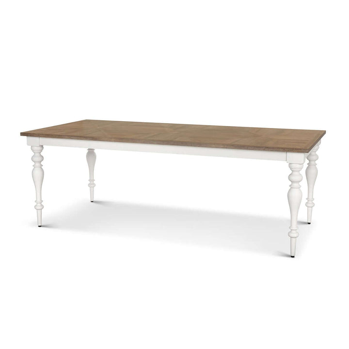 Farmhouse dining table with vintage white turned legs and rich wood top, ideal for country-style interiors and cozy gatherings.