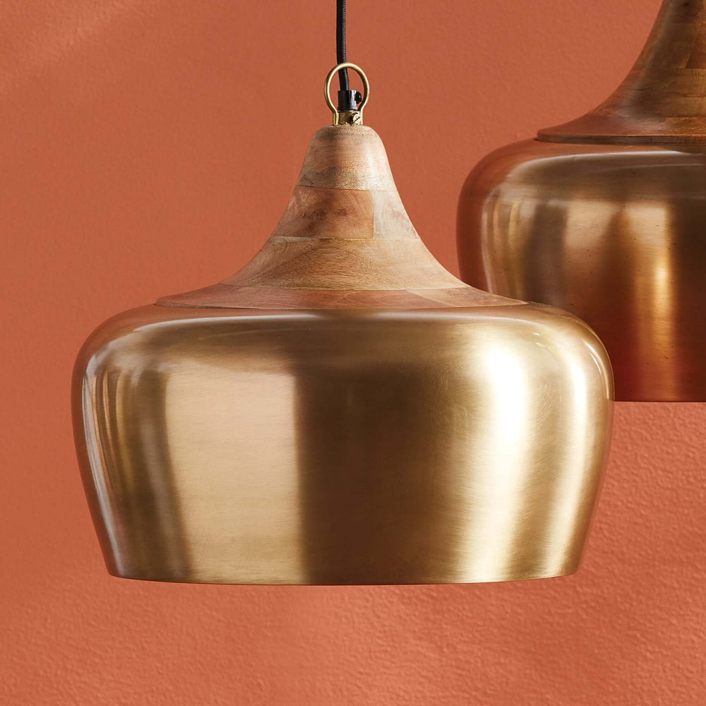 Farmhouse wood and satin brass pendant light with a soft golden sheen, blending modern elegance with warm, nostalgic design.