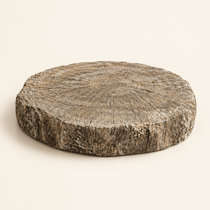 Round faux bois cement display riser on an ivory studio background