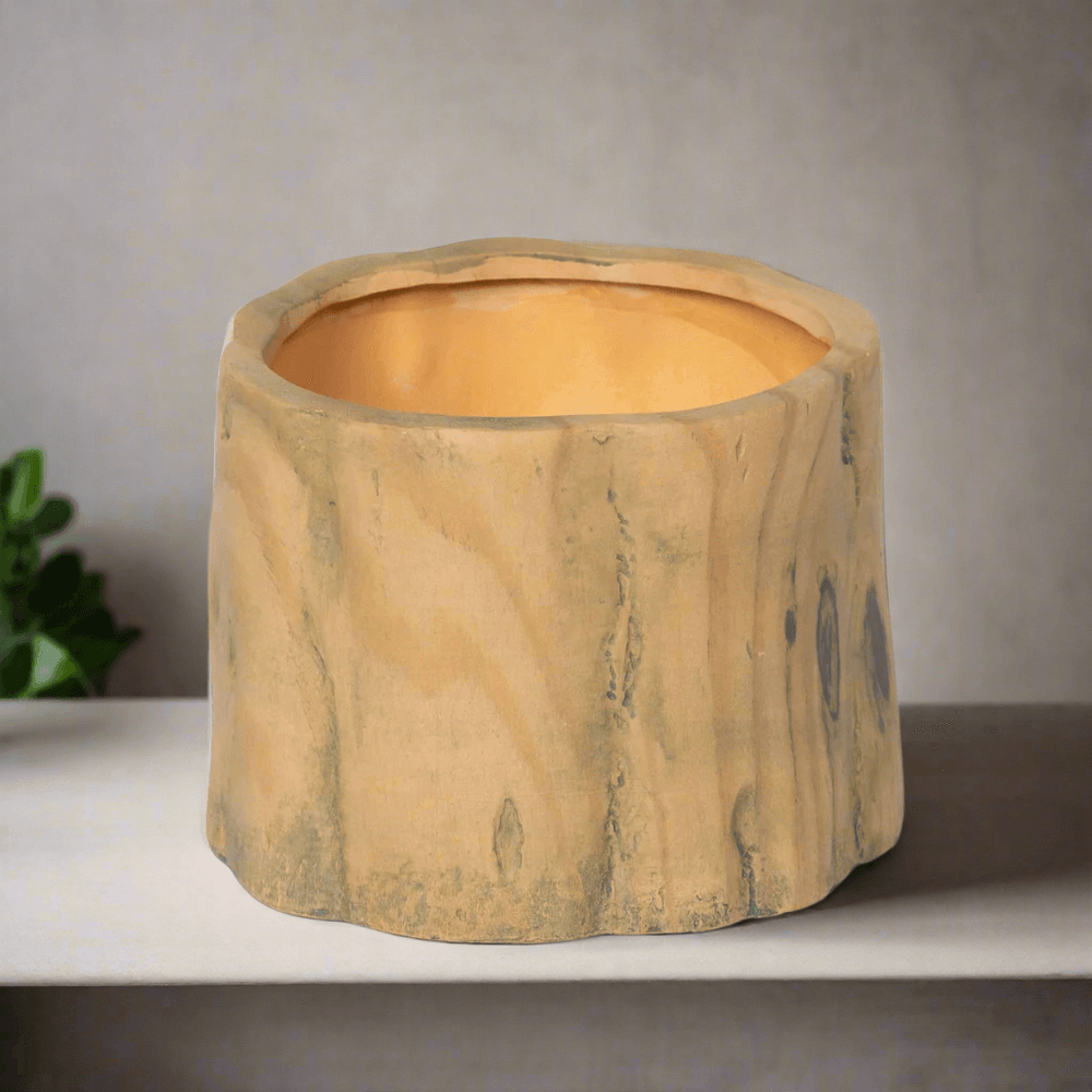 Faux Wood Tree Stump Planter with realistic grain and knot textures on display table.