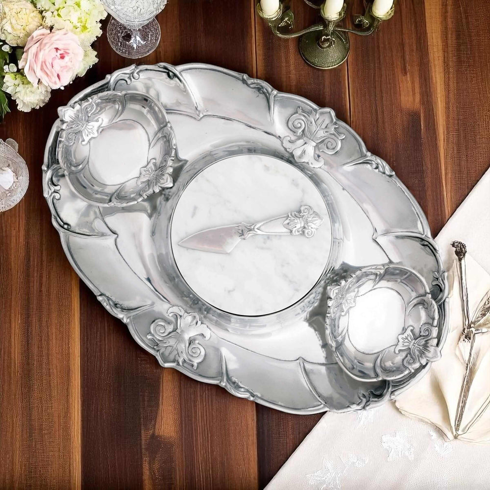 Fleur-De-Lis 5 Piece Serving Tray Set with intricate aluminum design on wooden table, part of Arthur Court collection.