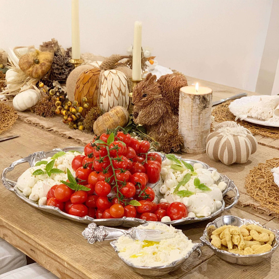 Arthur Court Fleur-De-Lis 5 Piece Serving Tray Set with food on a decorated table, showcasing French country elegance.