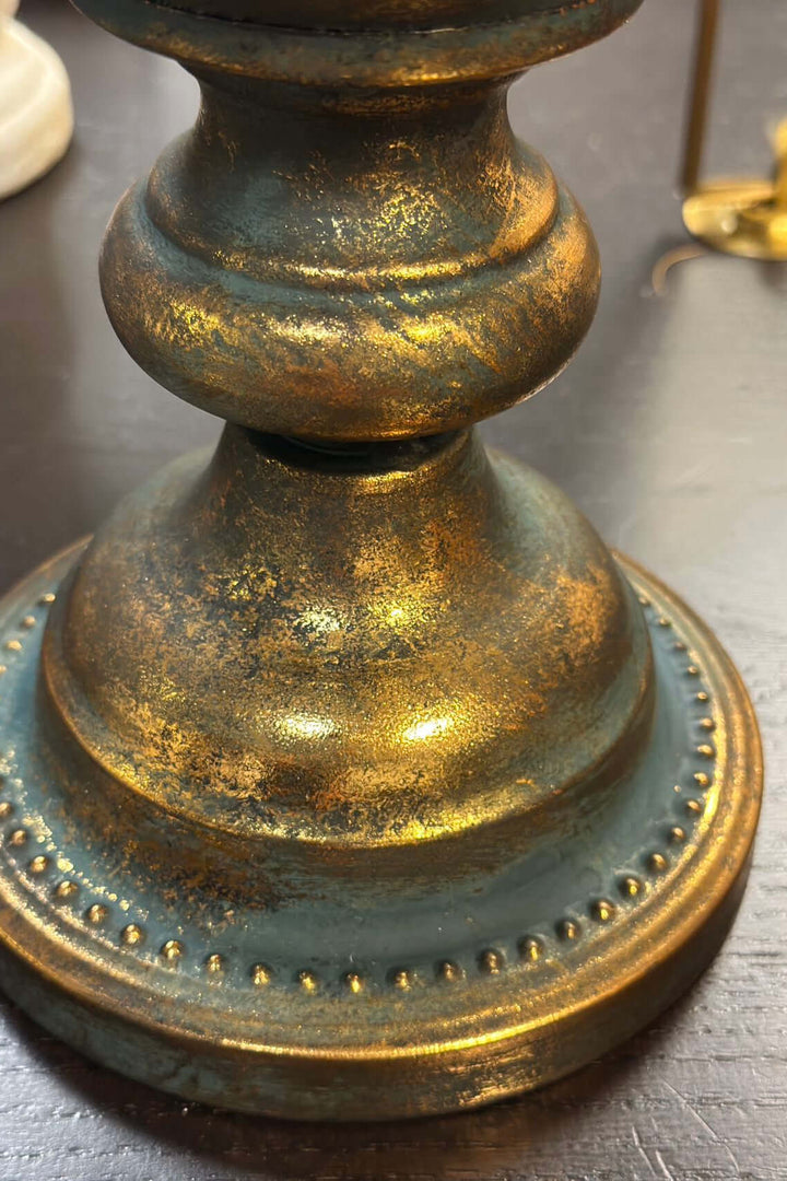 Antique gold vase base with distressed finish and intricate detailing.