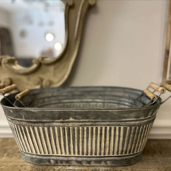 Empty Galvanized Iron Tray showing fluted sides and pale wood handles