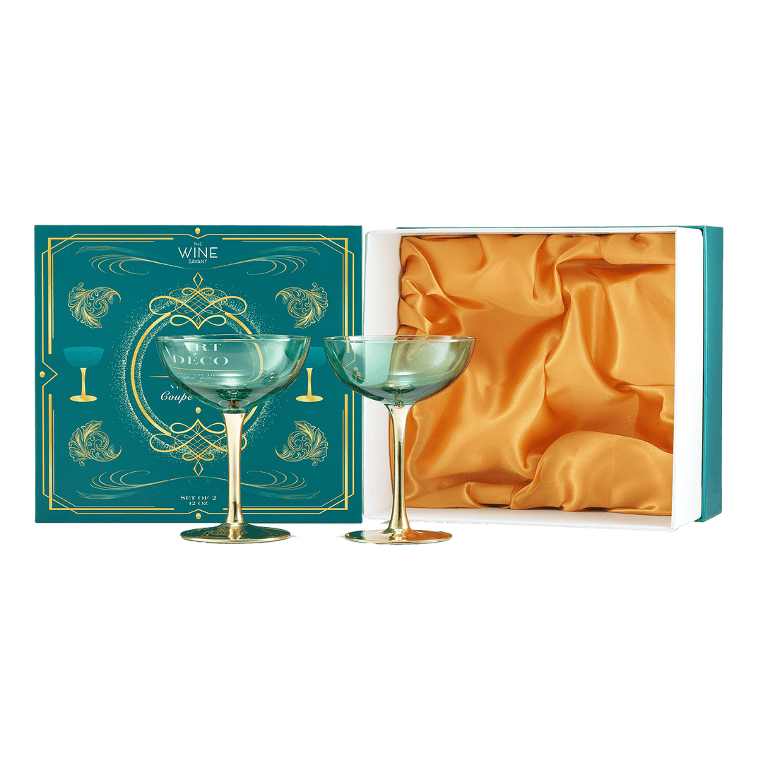 Two green wine glasses in a decorative box with gold accents