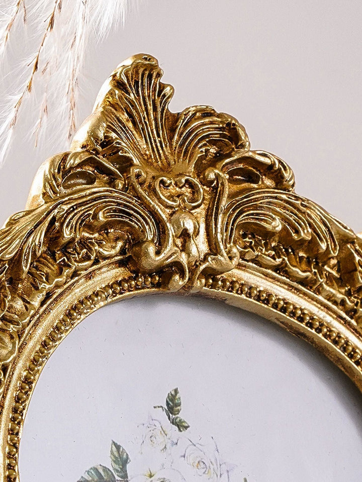 Close detail of the carved crest on a Gilded Baroque Arch Photo Frame