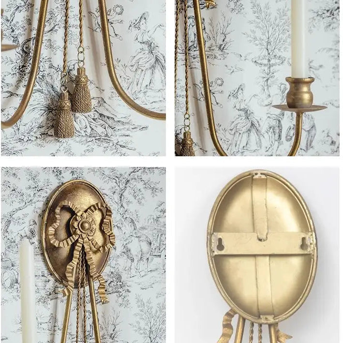 Close view of hanging tassels and curved candle arms
