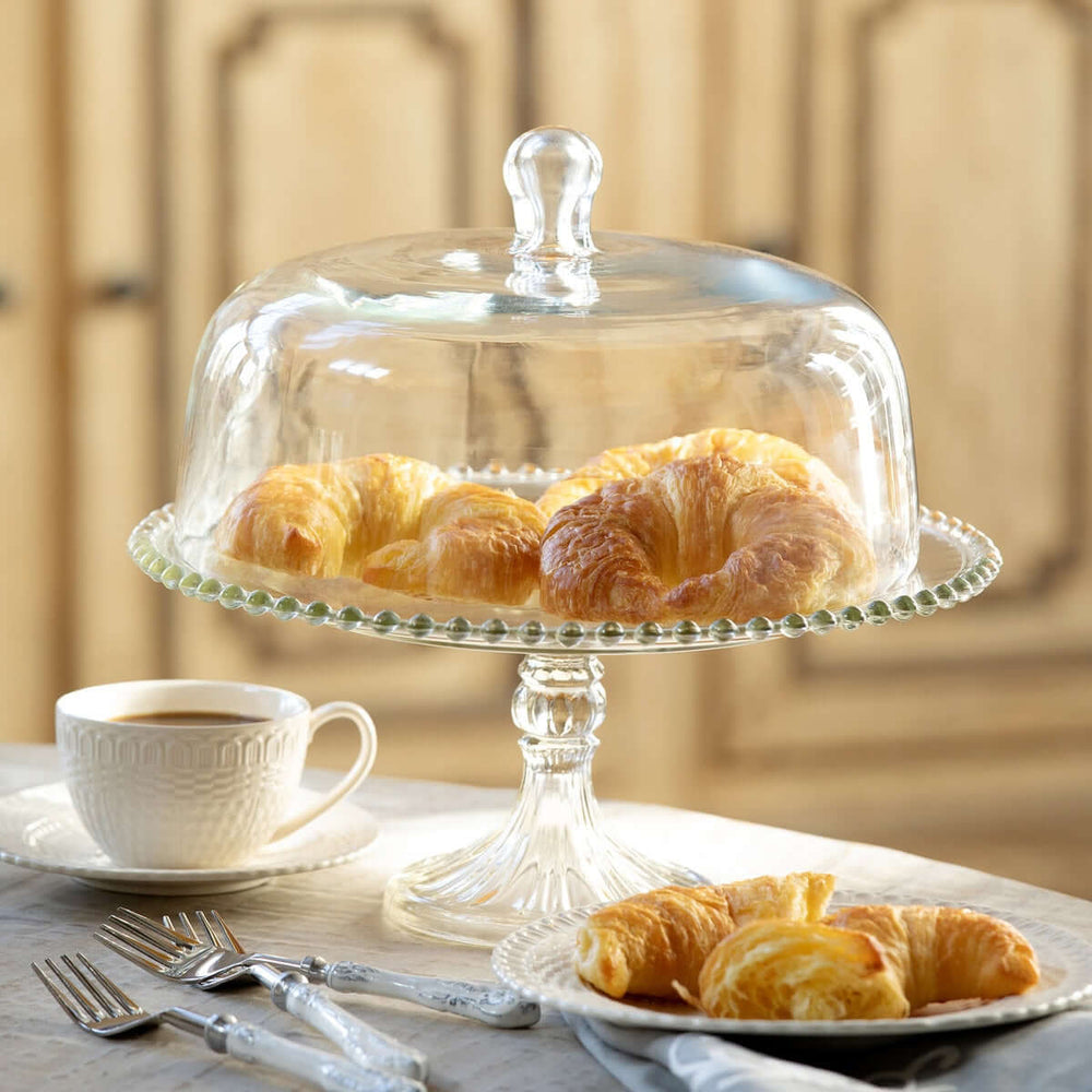 Glass Cake Stand with Dome and Beaded Edge Pedestal Plate showcasing croissants