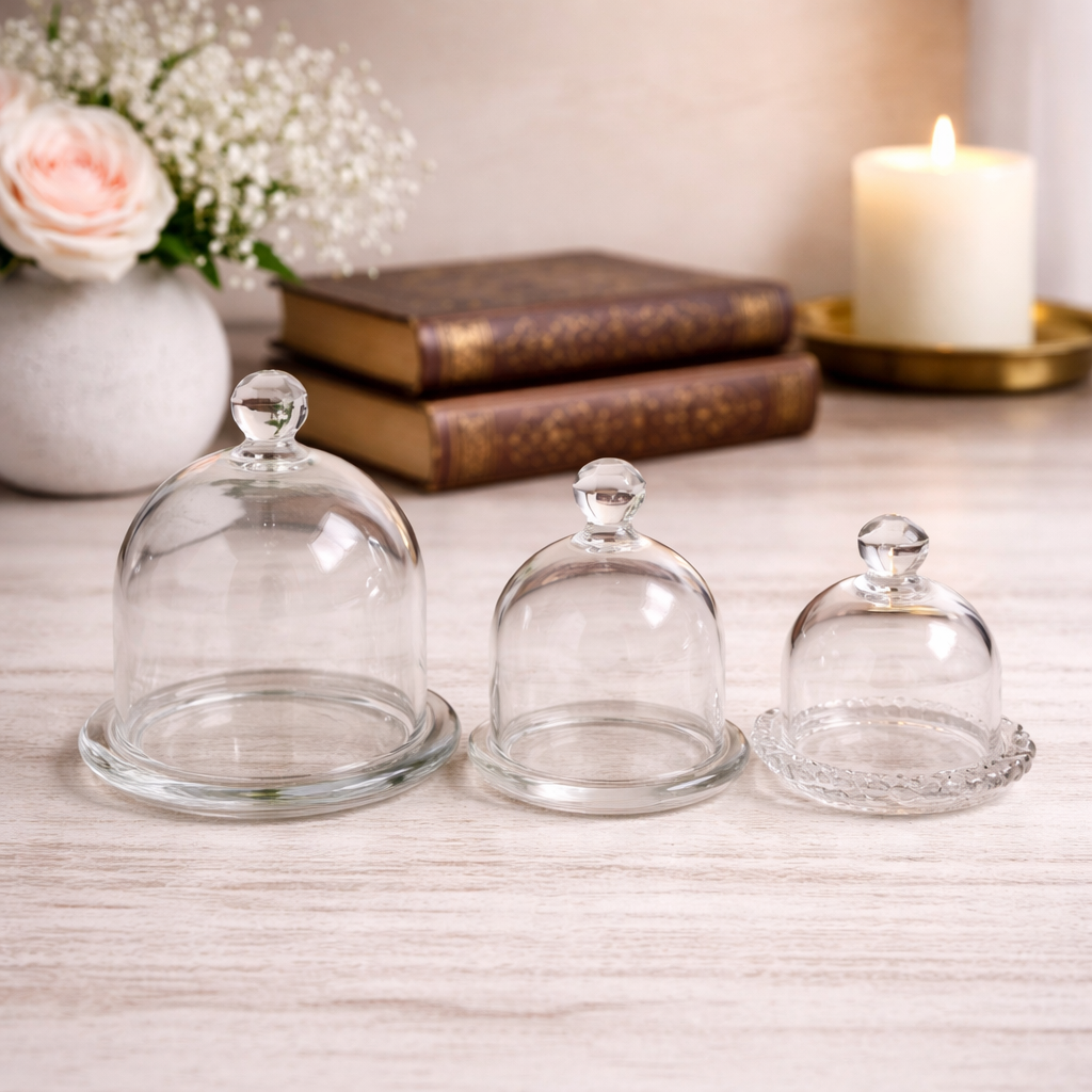 Glass Display Cloches with Bases showing the larger and smaller dome styles