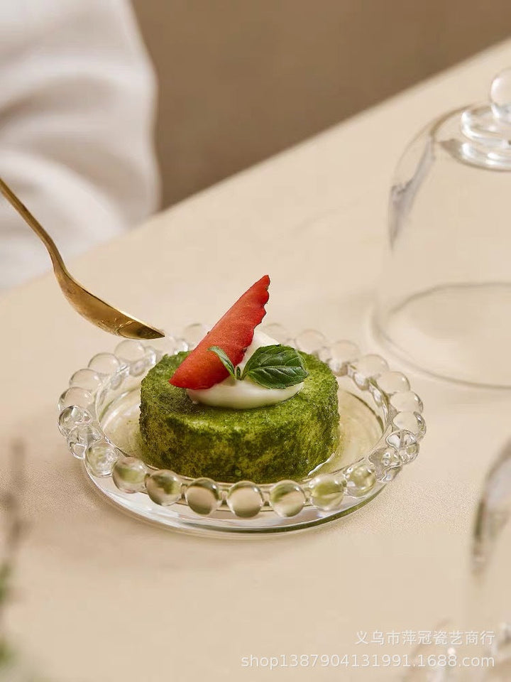 Small Glass Display Cloche with Base presenting a miniature dessert