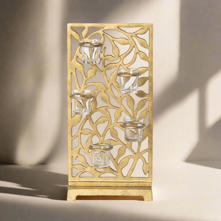 Gold Metal Jasmine Vine Votive Candle Holder with Glass Cups featuring intricate leaf cut-out design for elegant illumination.