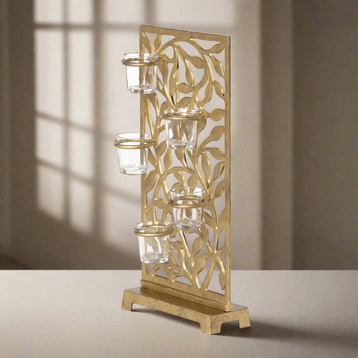 Gold Metal Jasmine Vine Votive Candle Holder with Glass Cups casting elegant shadows