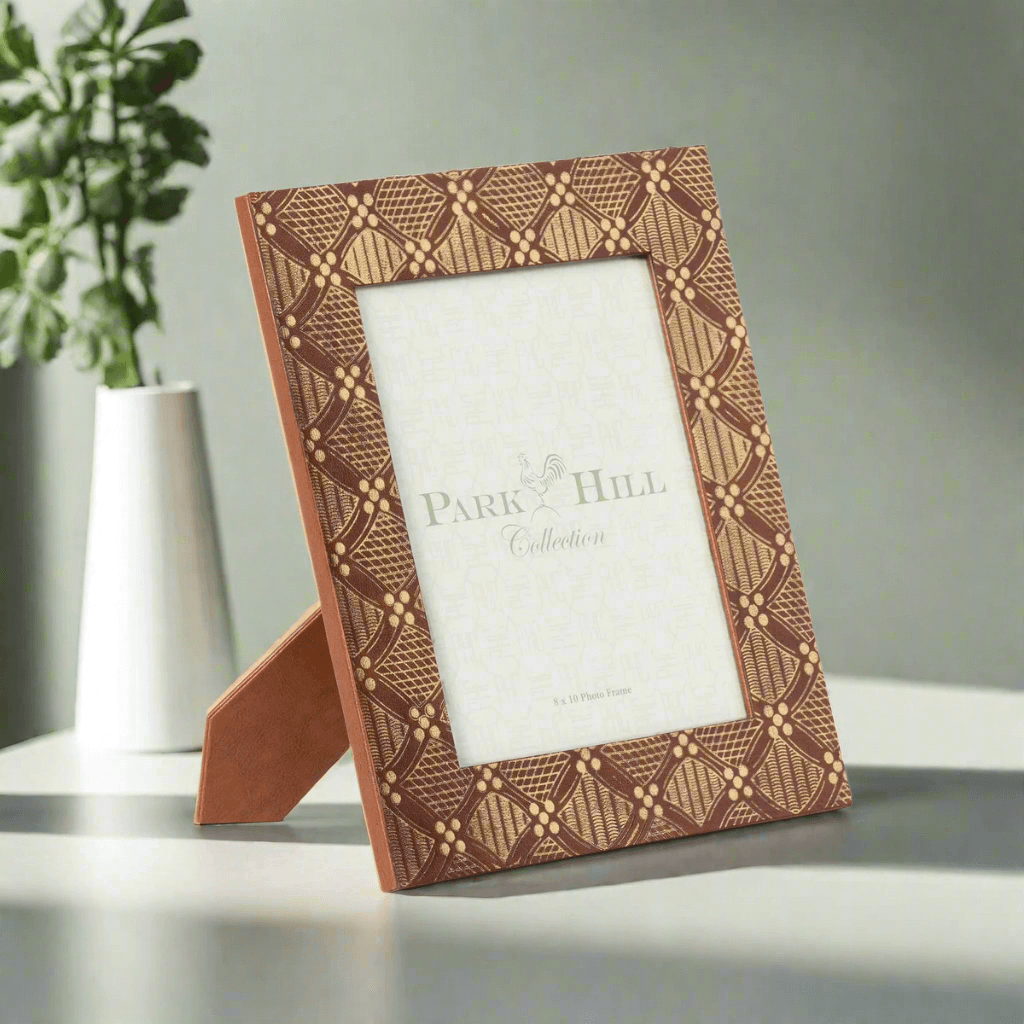 Gold Embossed Vintage Photo Frame (8x10 display) with geometric design on a table.