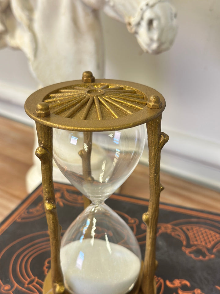 Top view of the golden branch hourglass showing the radiating metal cap