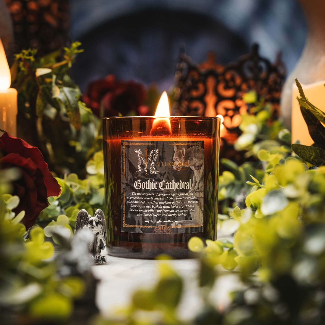 Gothic Cathedral Candle with flickering flame amid gothic decor, featuring patchouli and incense scent for a medieval ambiance.