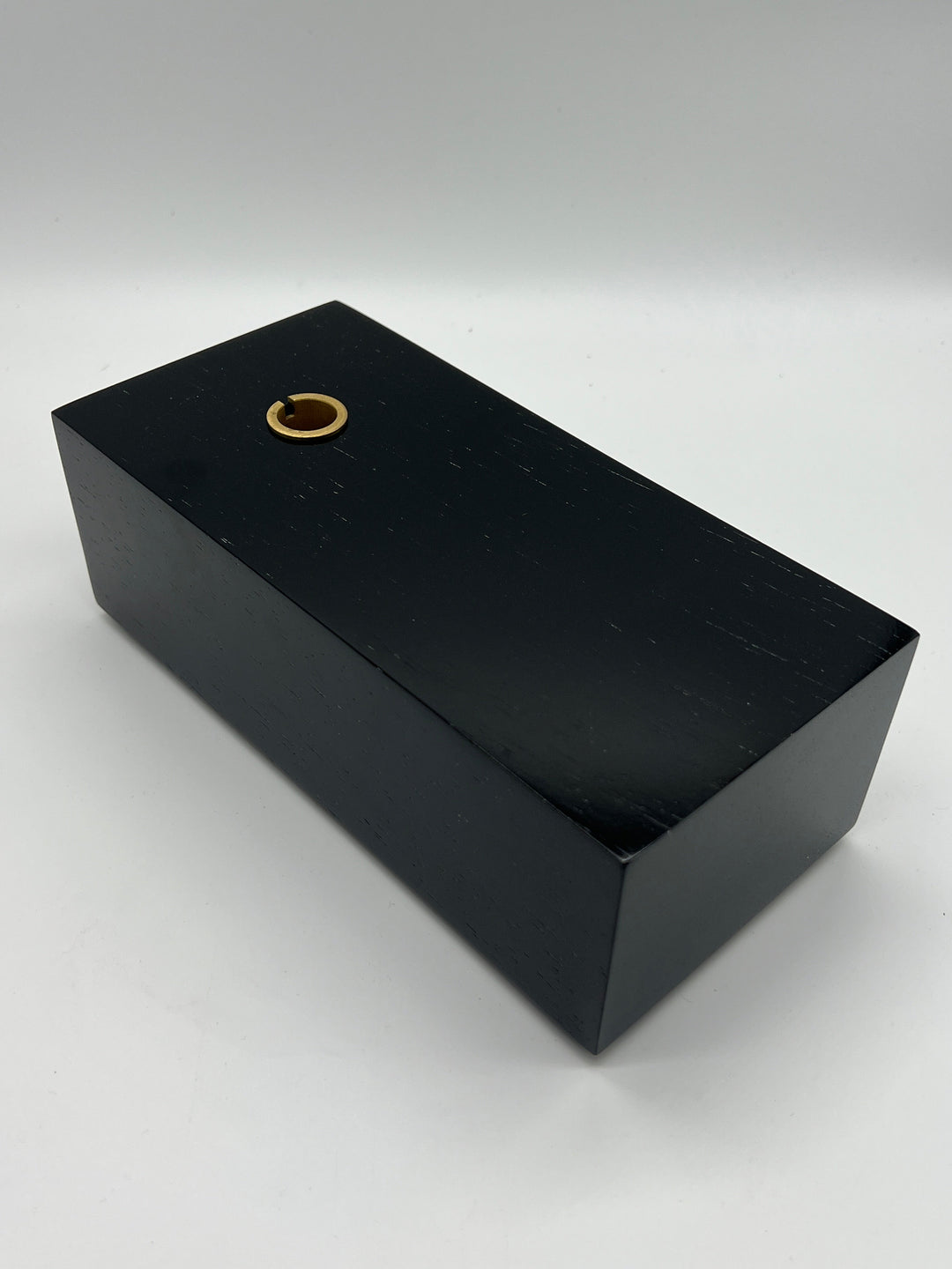 Black rectangular base of the Gramovox Bluetooth Gramophone Speaker with a brass connector.