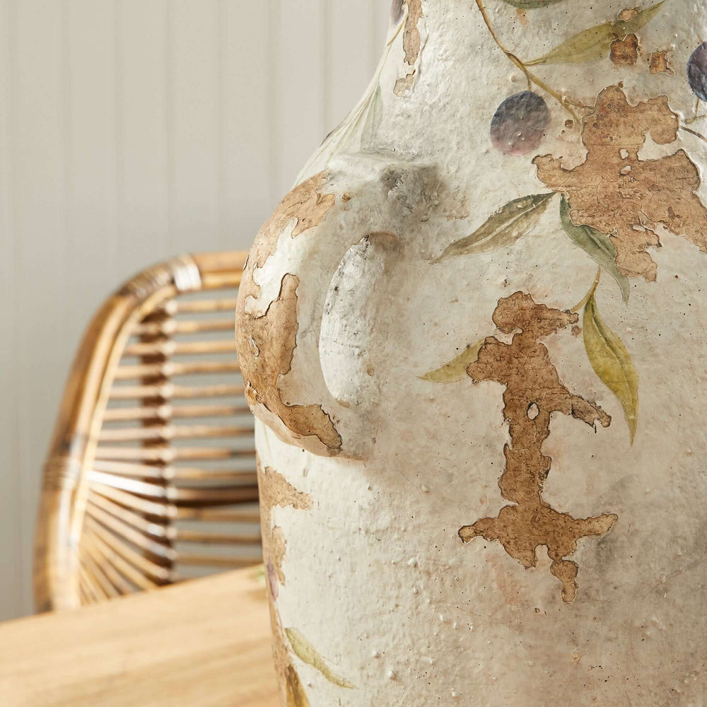 Hand-painted Italian ceramic urn showcasing olive vine details, highlighting rustic craftsmanship and Mediterranean charm.