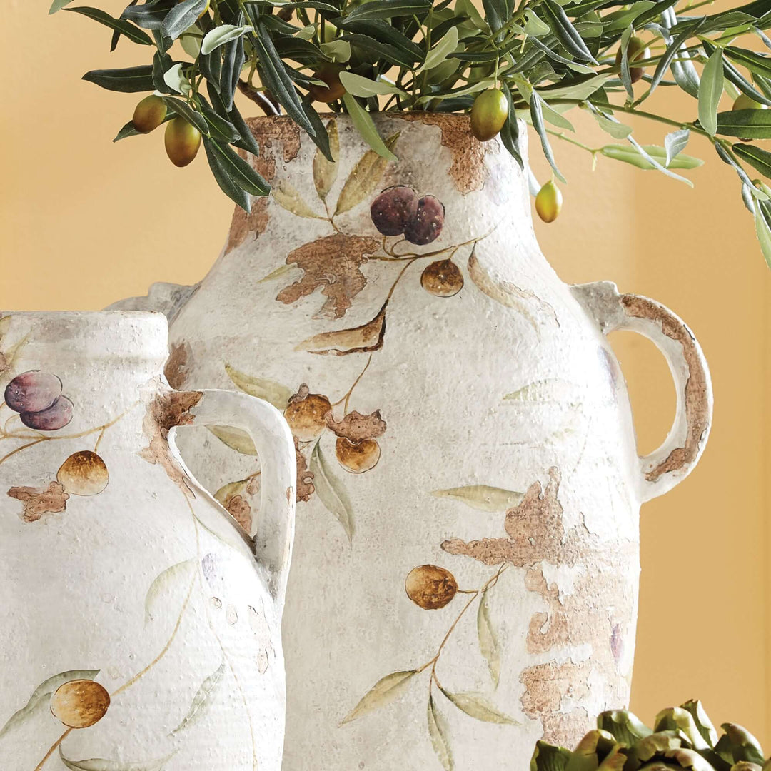 Hand-painted Italian ceramic urns featuring olive vine designs, perfect for rustic home decor.