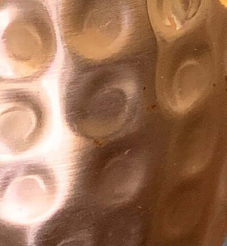 Close-up of handcrafted hammered copper Moscow Mule mugs texture showcasing craftsmanship and artisanal detail