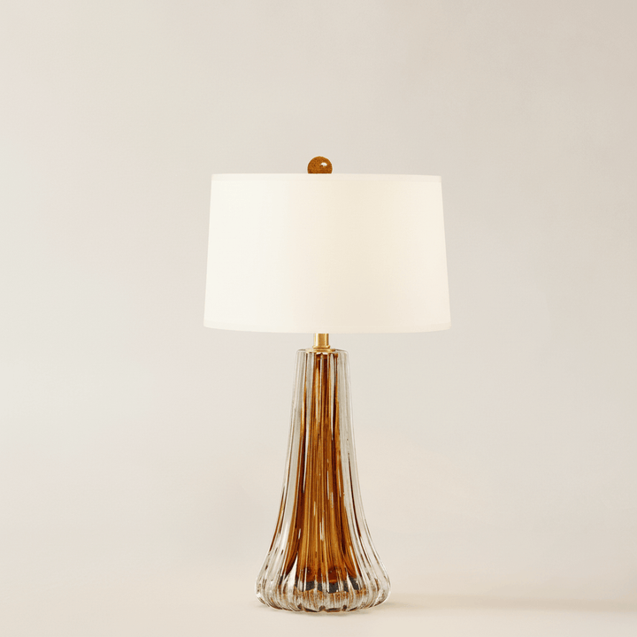Amber Murano glass table lamp on neutral background