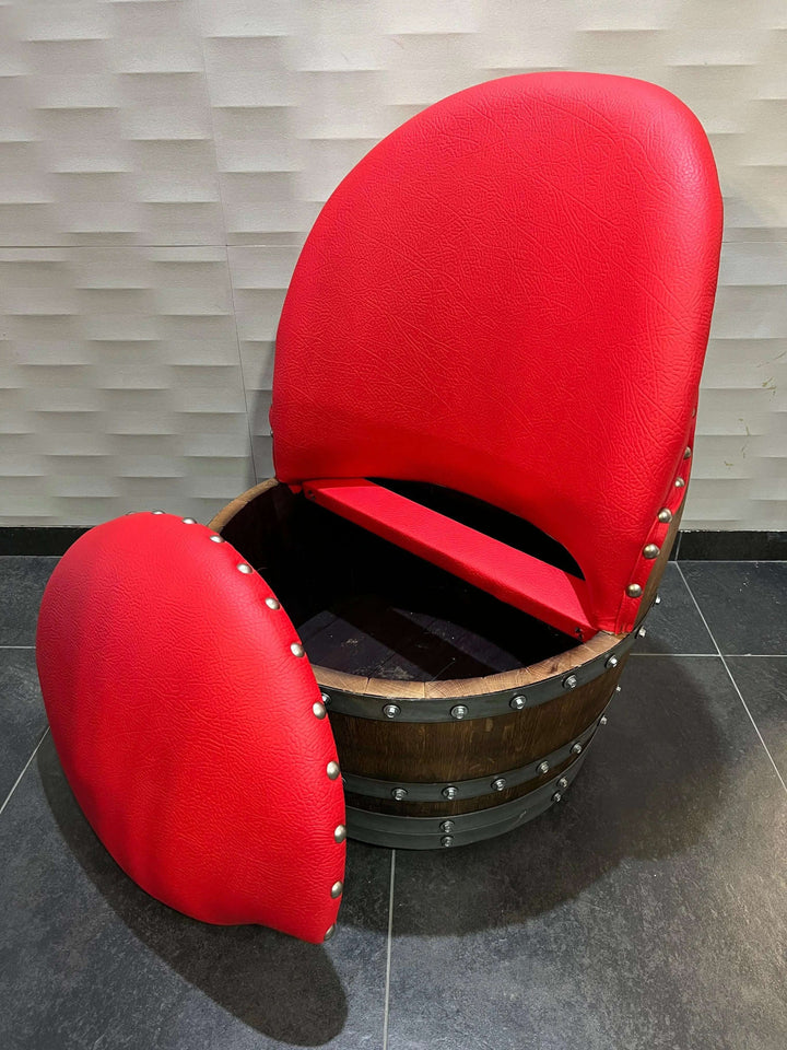 Handcrafted red cushioned chair made from vintage oak barrel, showcasing unique design and rustic elegance.